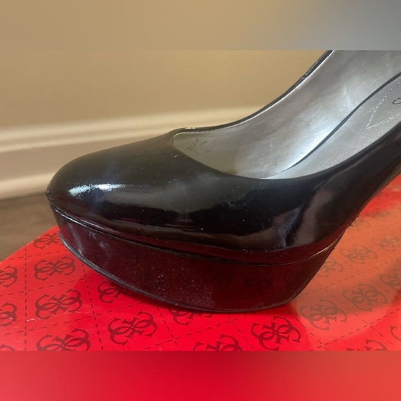 Used black guess high heels with normal tear from use. - Picture 4 of 5